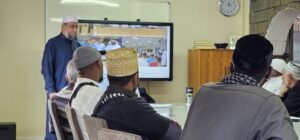 annur dawaa team attending a session of learnings and teachings from an islamic leader at annur center