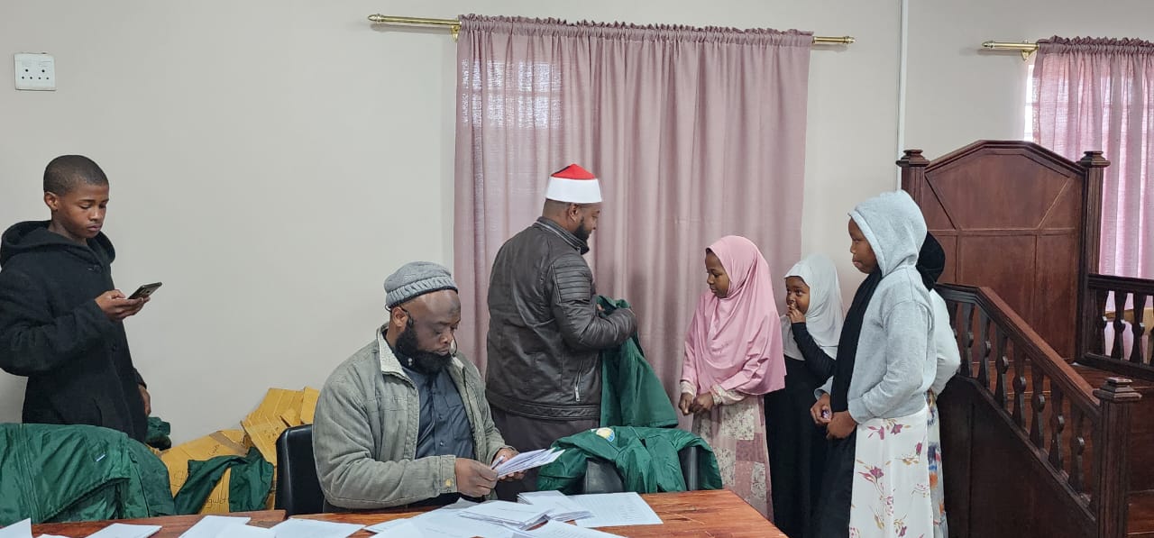 annur team giving orphans jackets in Capetown